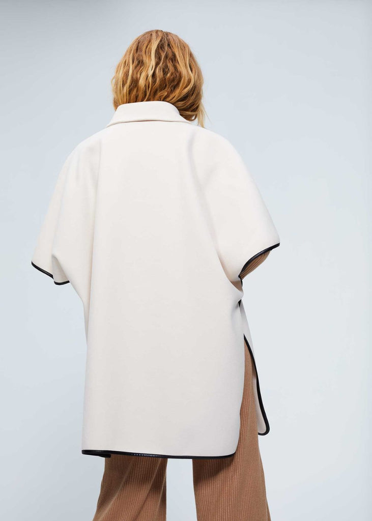Manteau cape en maille